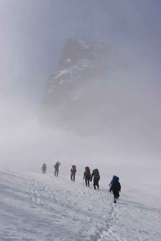 Climbers Ascending Through Cloud Below The Castle